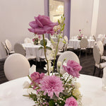 Lilac Round Table Centrepiece featuring seasonal flowers. Perfect for events, birthdays, christenings, parties.