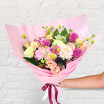 Pretty Pinks bouquet featuring seasonal pink and white flowers with lush greenery