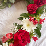 red and white flowers heart wreath