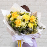 Beautiful seasonal yellow bouquet with columbian roses, chrysanthemums, misty, oriental kale, eucalyptus, lisianthius, alstroemeria, wattle, palm and greenery. Flower delivery Sydney. Sydney Florist.
