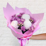 purple bouquet featuring seasonal flowers - roses, chrysanthemum, hypericum berry