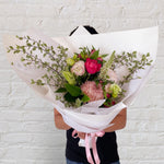 small bouquet featuring soft tones of flowers