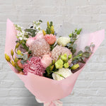 small bouquet featuring soft tones of flowers