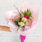 small bouquet featuring soft tones of flowers