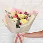 soft and pretty bouquet featuring soft pastel seasonal flowers