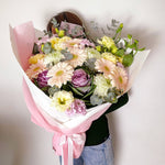 soft and pretty bouquet featuring soft pastel seasonal flowers