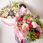 soft and pretty bouquet featuring soft pastel seasonal flowers