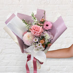 soft and pretty bouquet featuring soft pastel seasonal flowers