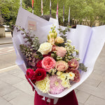 Ranunculus, delphinium, columbian rose, dahlia, cymbium orchid, lisithanius bouquet