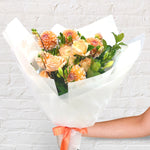 sunset orange bouquet featuring seasonal flowers - roses, dahlias, greenery