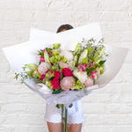 soft tone bouquet featuring lilies, roses, chrysanthemum, alstromeria, greenery.