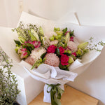 soft tone bouquet featuring lilies, roses, chrysanthemum, alstromeria, greenery.