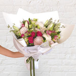 soft tone bouquet featuring lilies, roses, chrysanthemum, alstromeria, greenery.