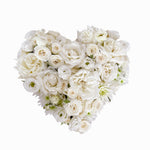 white filled heart wreath featuring seasonal flowers - roses, spray roses, chrysanthemum.