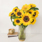 A glass vase of sunflowers.