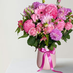 Soft Pink and lilac vase arrangement in pink vase