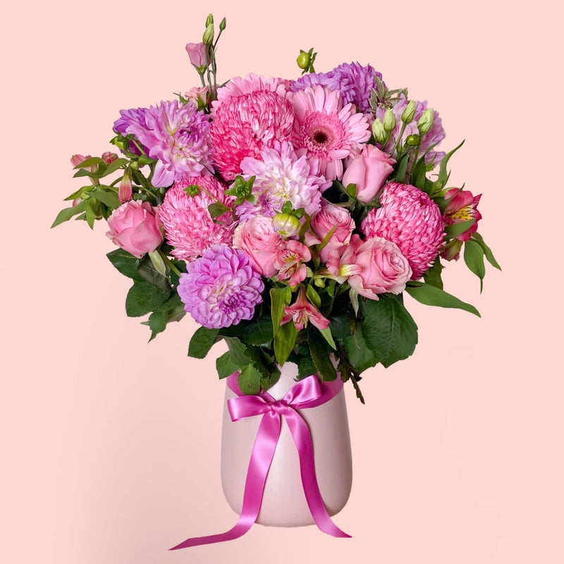 Soft Pink and lilac vase arrangement in pink vase