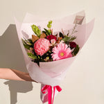 Pretty Pink bouquet with gerberas, carnations, chrysanthemum mums, magnolias, forest fern, molucca balm
