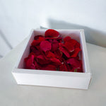 red rose petals in presentational box