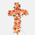 Orange flowers cross wreath with white stand