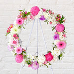 Soft pink and lilac round wreath with white stand