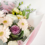 Beautiful seasonal soft and pastel bouquet with columbian roses, magnolia, chrysanthemums, ecalyptus, oriental kale, lisianthus and greenery. Flower delivery Sydney. Sydney Florist. 