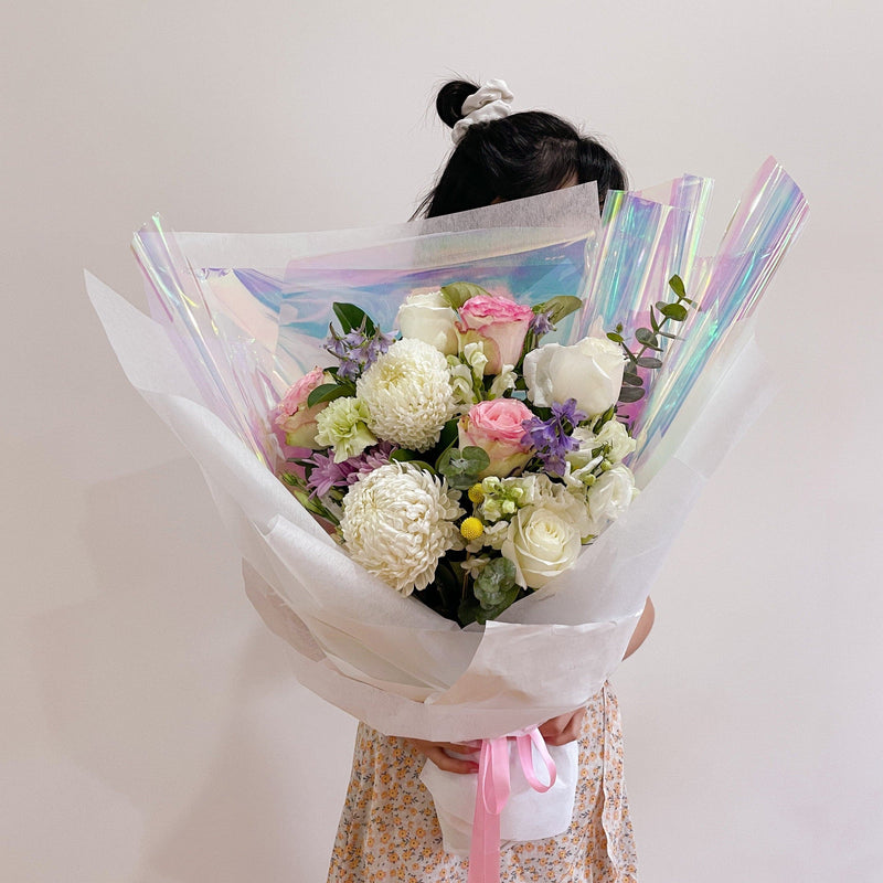 Beautiful seasonal bouquet with chrysanthemums, columbian roses, eucalyptus, delphinium, lisianthus and carnations. Flower delivery Sydney. Sydney Florist. Flower subscription. 