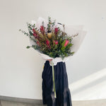 Beautiful seasonal native bouquet with proteas, eucalyptus, leucadendrons, banksia. Flower delivery Sydney. Sydney Florist. 