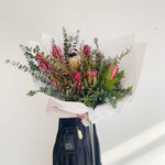 Beautiful seasonal native bouquet with proteas, eucalyptus, leucadendrons, banksia. Flower delivery Sydney. Sydney Florist. 