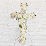 White Cross Wreath featuring white seasonal flowers - roses, alstromeria, lisianthus, chrysanthemums 
