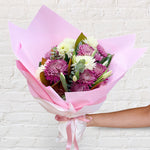 purple bouquet featuring seasonal flowers - roses, chrysanthemum, stock, eucalyptus and eucalyptus 