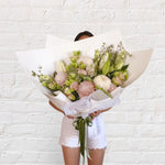 soft blush bouquet featuring roses, chrysanthemum, lilies, lisianthus, greenery 