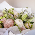 soft blush bouquet featuring roses, chrysanthemum, lilies, lisianthus, greenery 